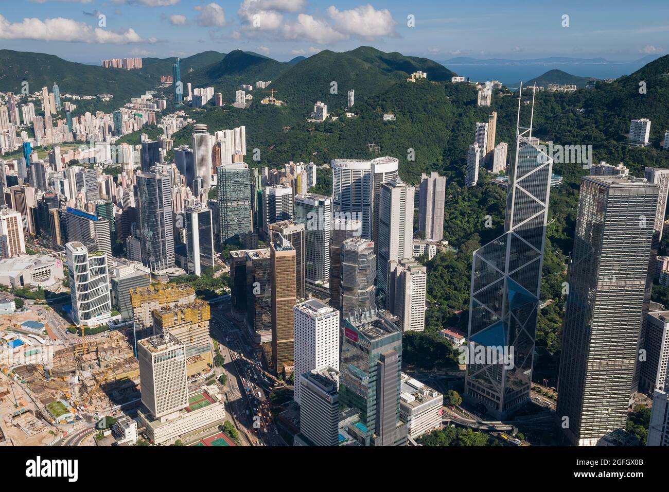 The high-rise residential apartment blocks of Happy Valley behind the commercial buildings of Admiralty, with the Tamar construction site, 2010 Stock Photo