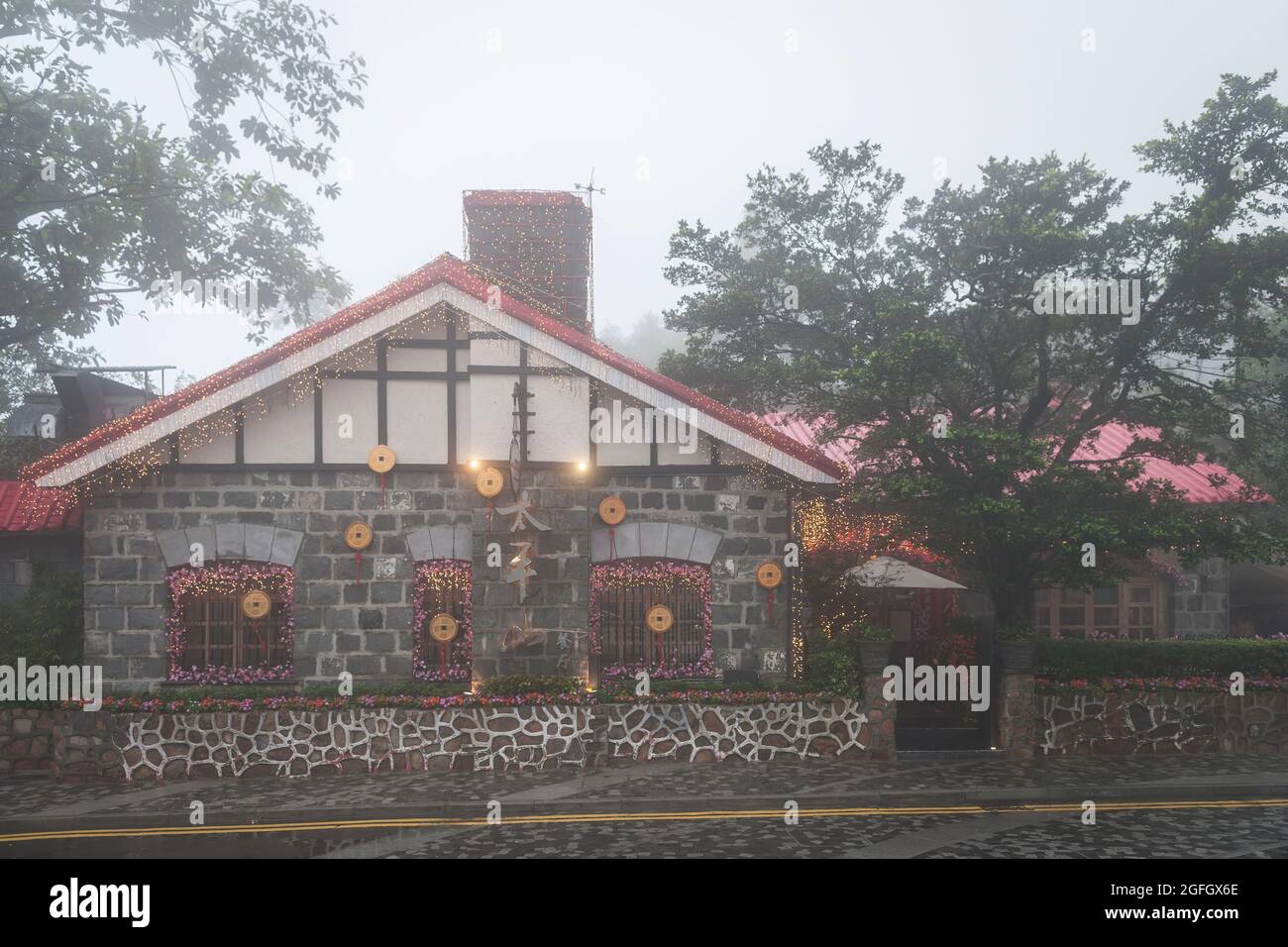 The Peak Lookout restaurant, Hong Kong Island, in mist, decorated