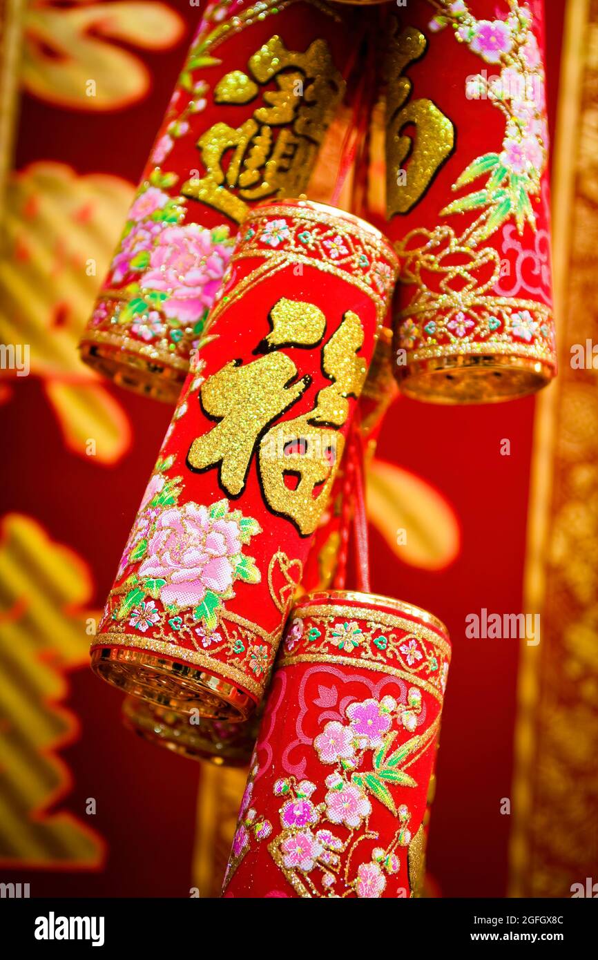 Ornate imitation firecrackers used for Chinese New Year decorations for sale on display in a shop in Sheung Wan, Hong Kong Island Stock Photo