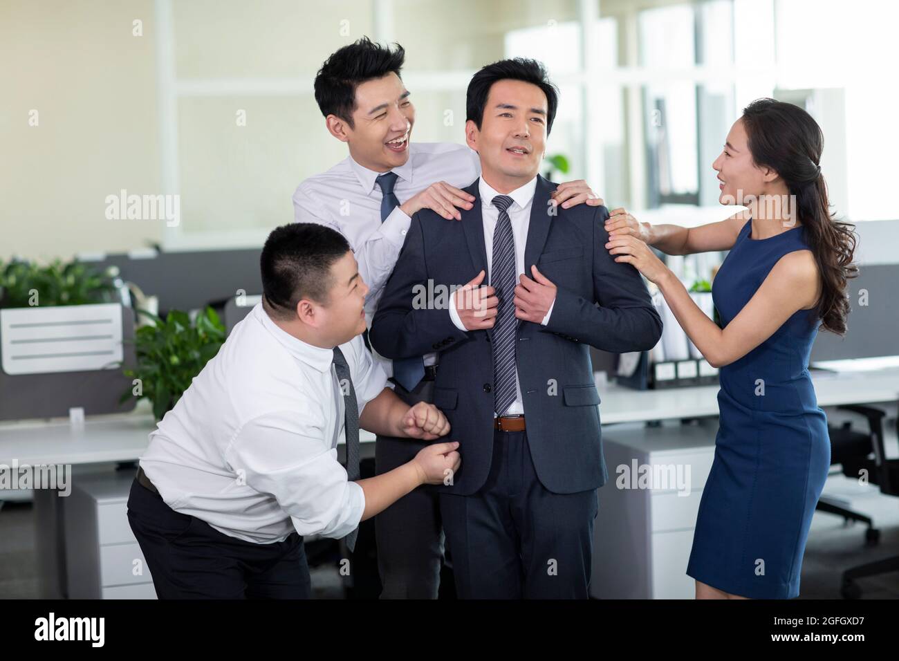 Employees flattering manager Stock Photo