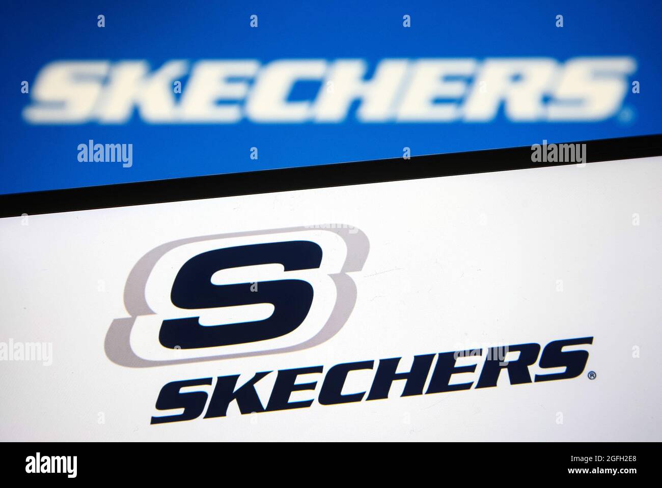 In this photo illustration a Skechers logo is seen on a smartphone and a pc  screen. (Photo by Pavlo Gonchar / SOPA Images/Sipa USA Stock Photo - Alamy