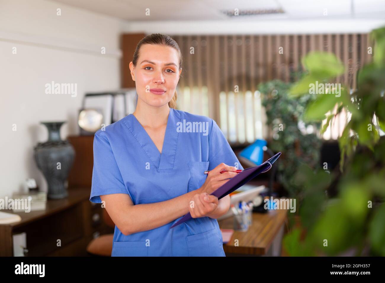 Woman doctor wear white medical uniform and stethoscope with folder of ...
