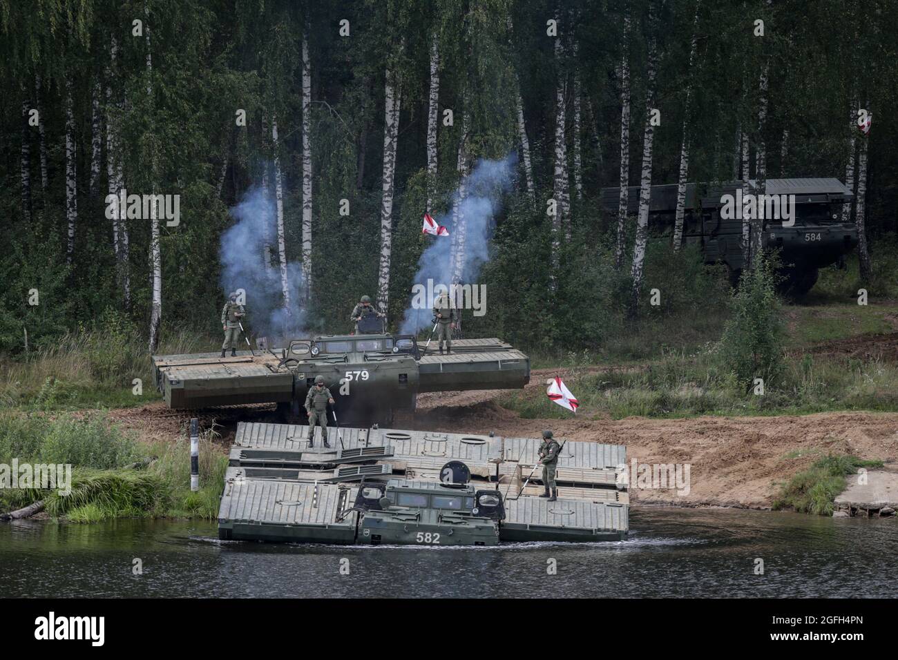 Moscow, Russia. 24th Aug, 2021. Russian Army engineers set the PMM-2M pontoon floating bridge during the annual Army Games defense technology international exhibition. The International Army Games is an annual Russian military sports event organized by the Ministry of Defense of Russia. The event, which was first staged in August 2015, involves close to 30 countries taking part in dozens of competitions over two weeks to prove which is the most skilled. Dynamic demonstration is a part of the Army Games public display Credit: SOPA Images Limited/Alamy Live News Stock Photo