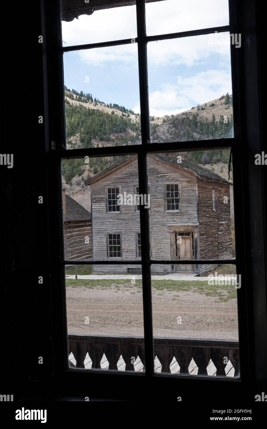 Buildings through window from across the street, Bannack State Park, MT. Stock Photo