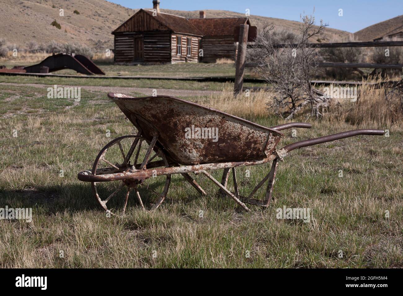 Rusting wheelbarrow, Bannack State Park, MT. Stock Photo