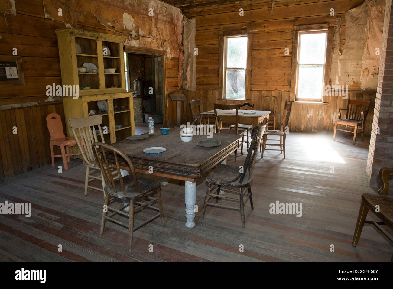 Dining room in the Wells Hotel, the largest and most elaborate building still standing in the ghost town, Garnet, MT. Stock Photo