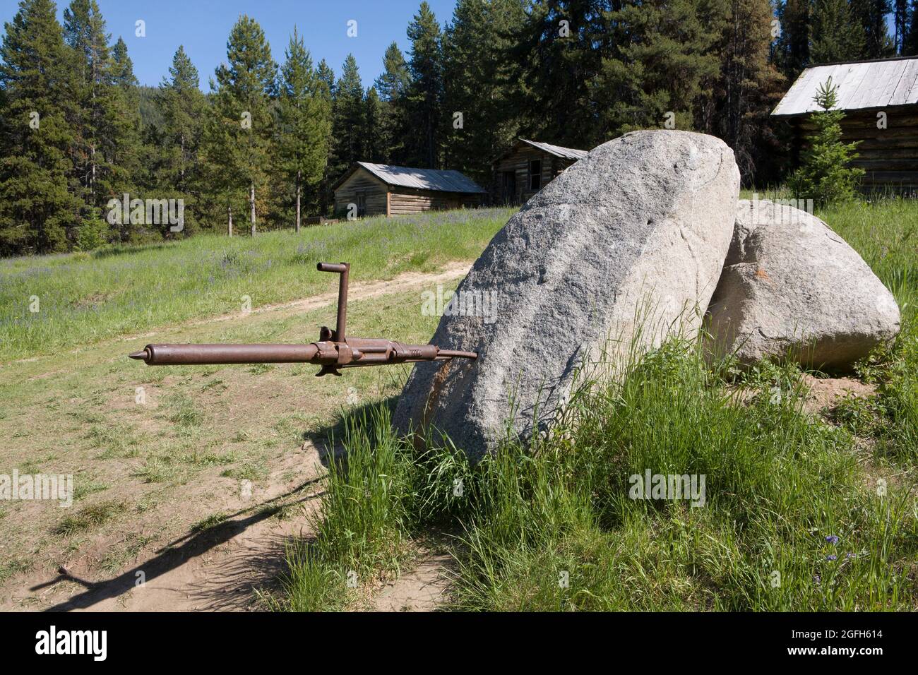 An air powered mining drill is left stuck in a boulder, Garnet, MT. Stock Photo