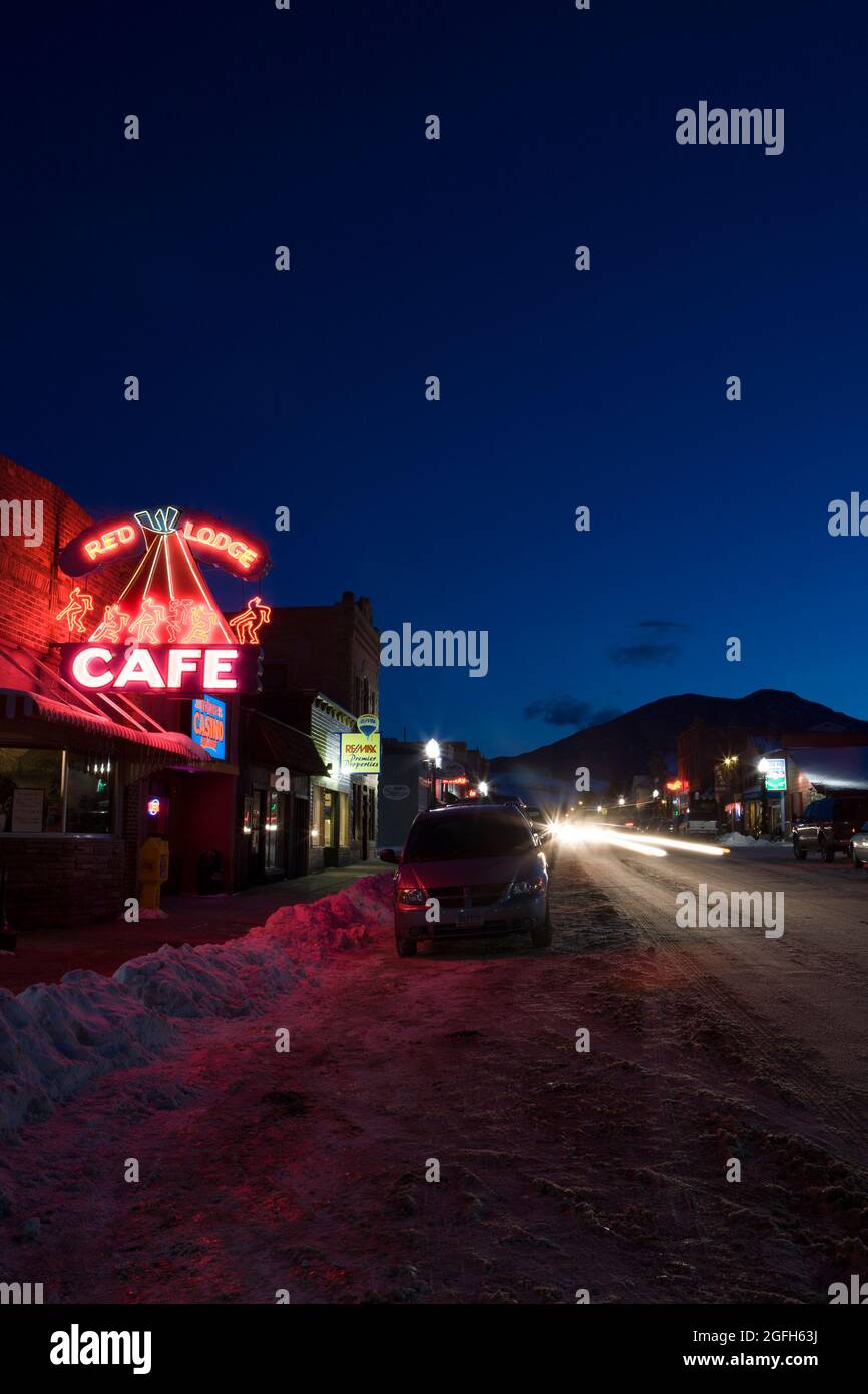 Neon signs gleam, head and tail lights streak and the horizon fades