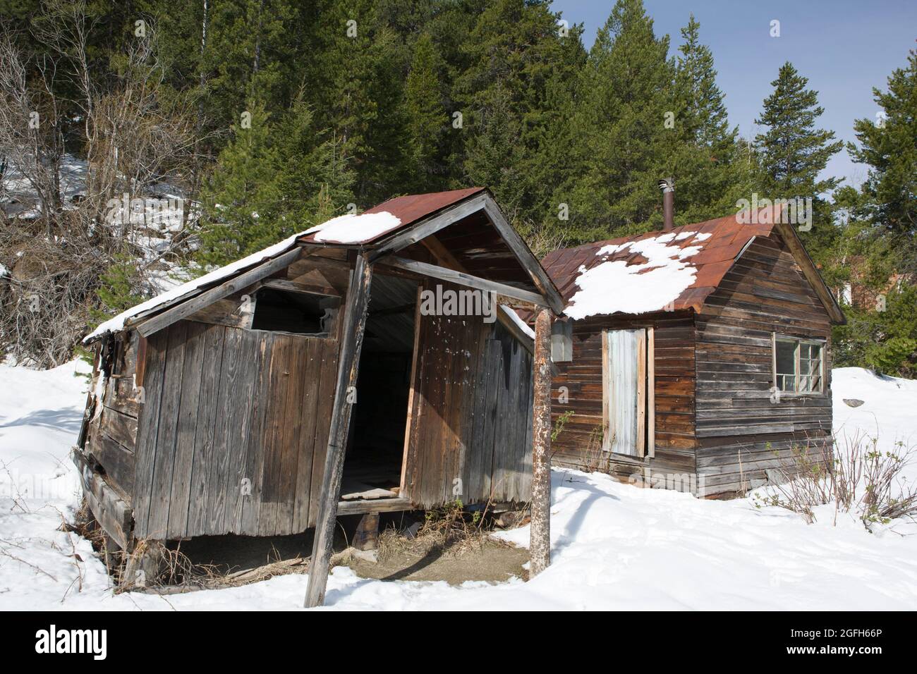 Dilapidated wooden miner's cabins showing their age, Granite Ghost Town State Park, MT. Stock Photo