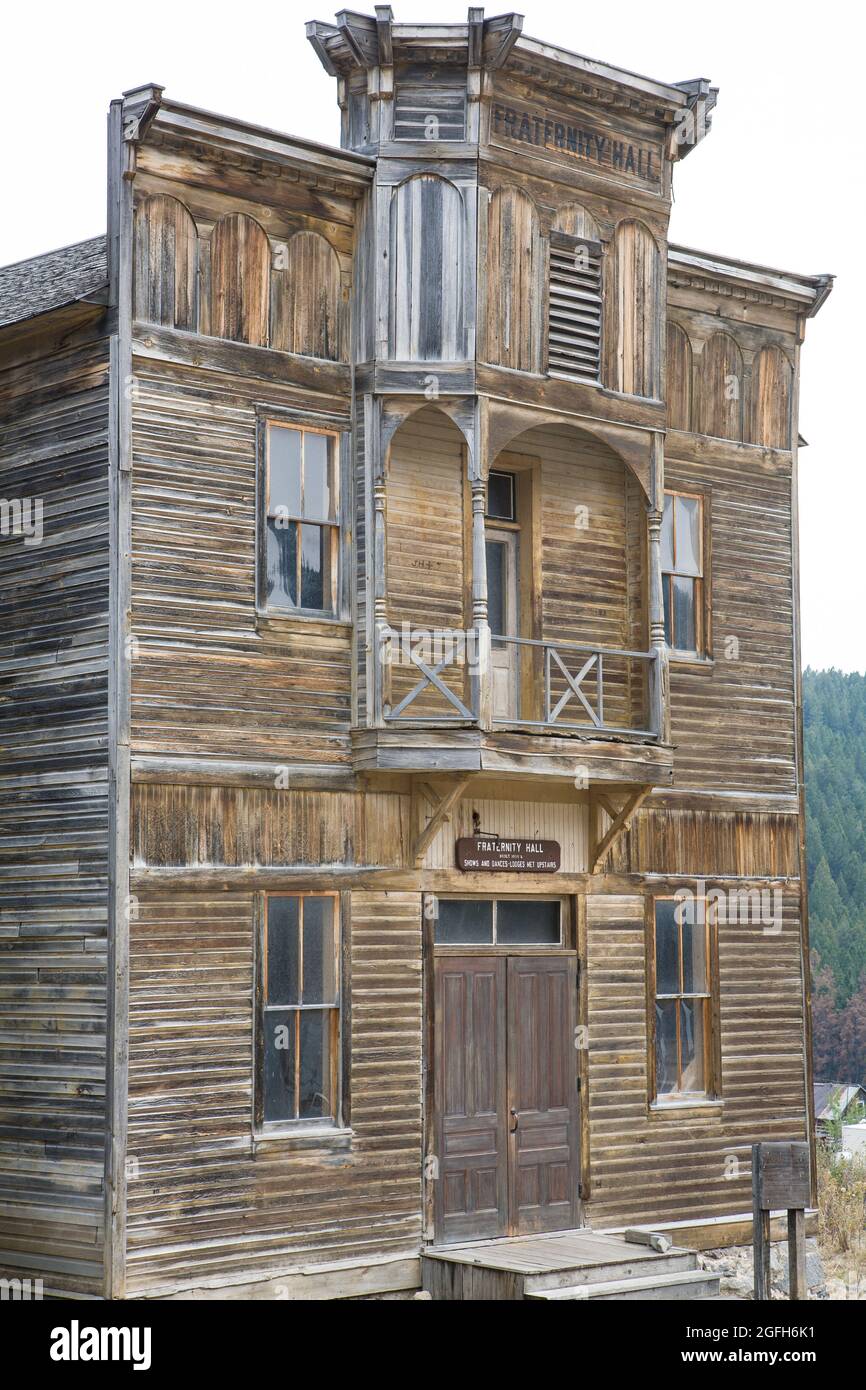 Weathered exterior of Fraternity Hall shows the ravages of time since the 1890s, Elkhorn State Park, MT. Stock Photo