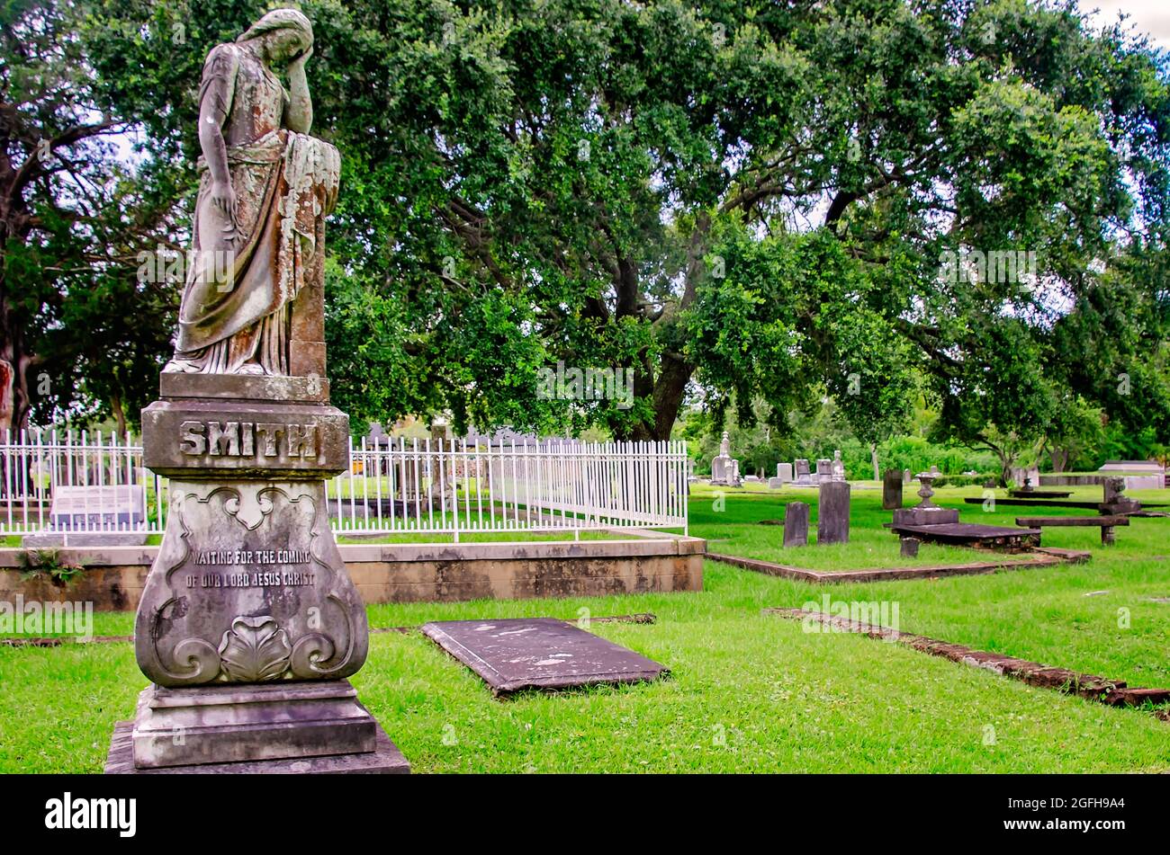 A cemetery angel stands over the Smith grave at Magnolia Cemetery, Aug. 14, 2021, in Mobile, Alabama. Stock Photo
