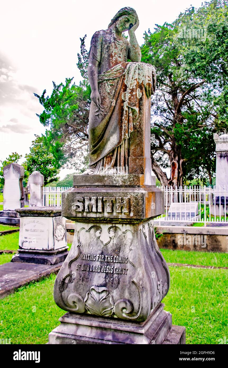 A cemetery angel stands over the Smith grave at Magnolia Cemetery, Aug. 14, 2021, in Mobile, Alabama. Stock Photo