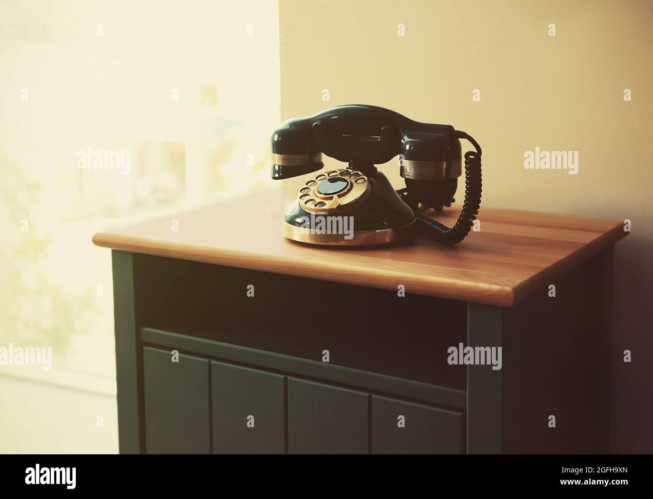 Old telephone on table in the room Stock Photo Alamy