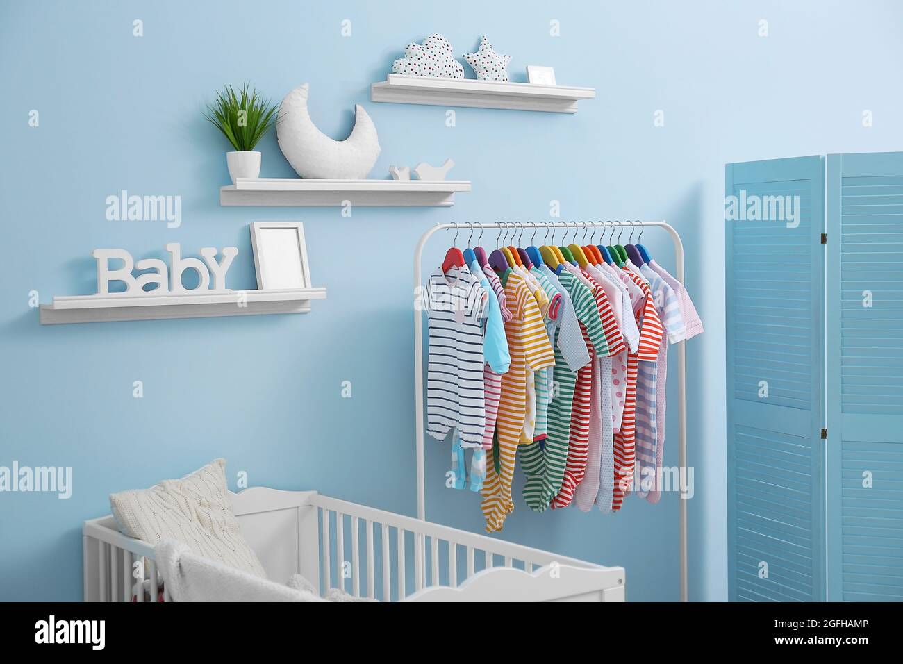 Shelves with hanger in modern baby room Stock Photo Alamy