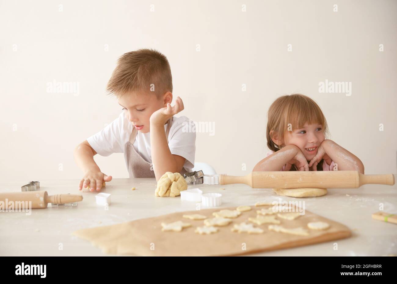 Kids making biscuits in kitchen Stock Photo - Alamy