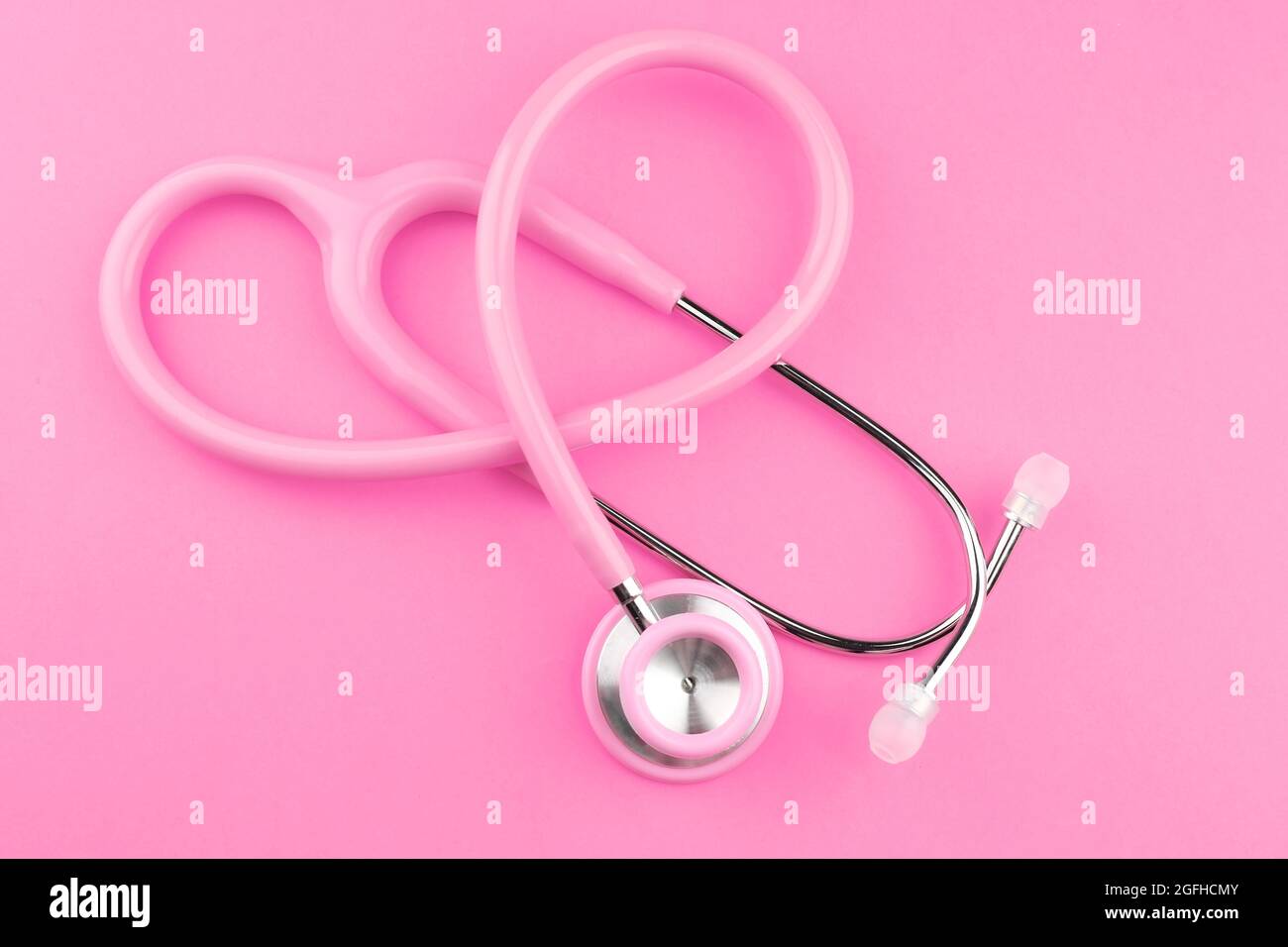 Pink stethoscope on pink background Stock Photo - Alamy