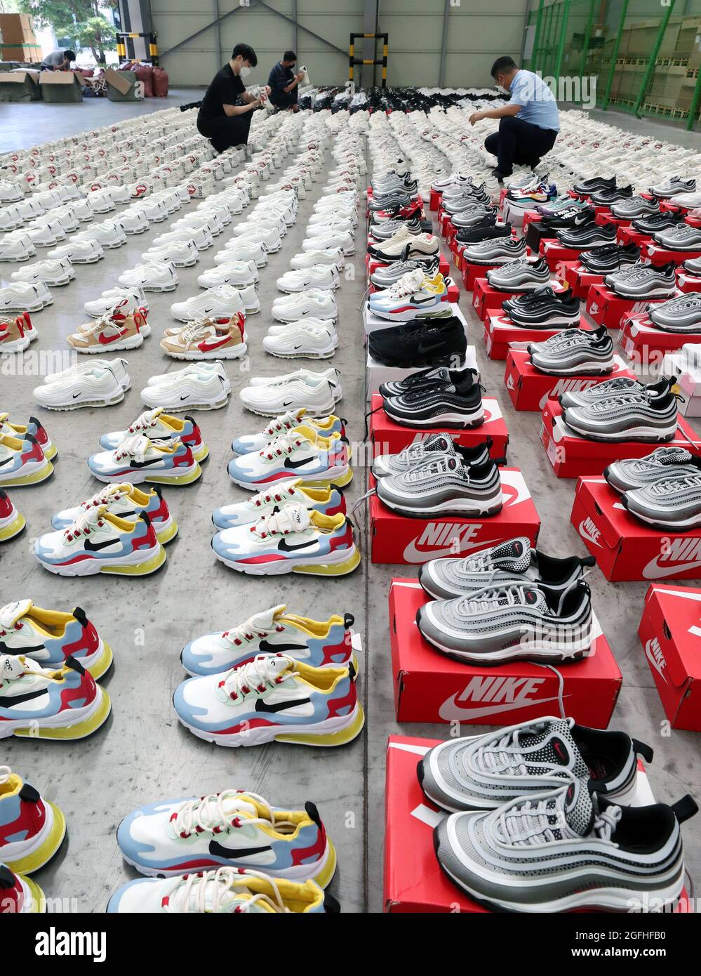 Korea. 26th Aug, 2021. 26th Aug, 2021. Fake designer sneakers seized in Busan Customs officials display thousands of sneakers of and other brands have confiscated at a warehouse