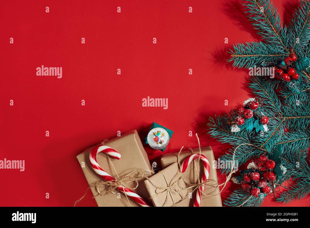 Christmas composition of pine cones, spruce branches and stack of gift ...