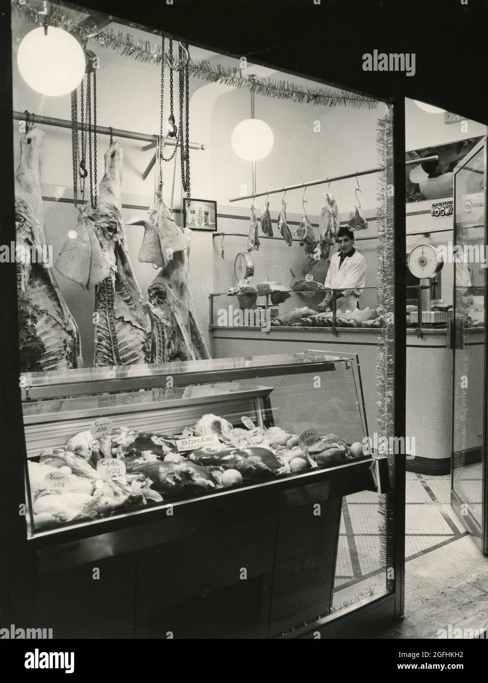 Butcher's shop window, Italy 1970s Stock Photo Alamy