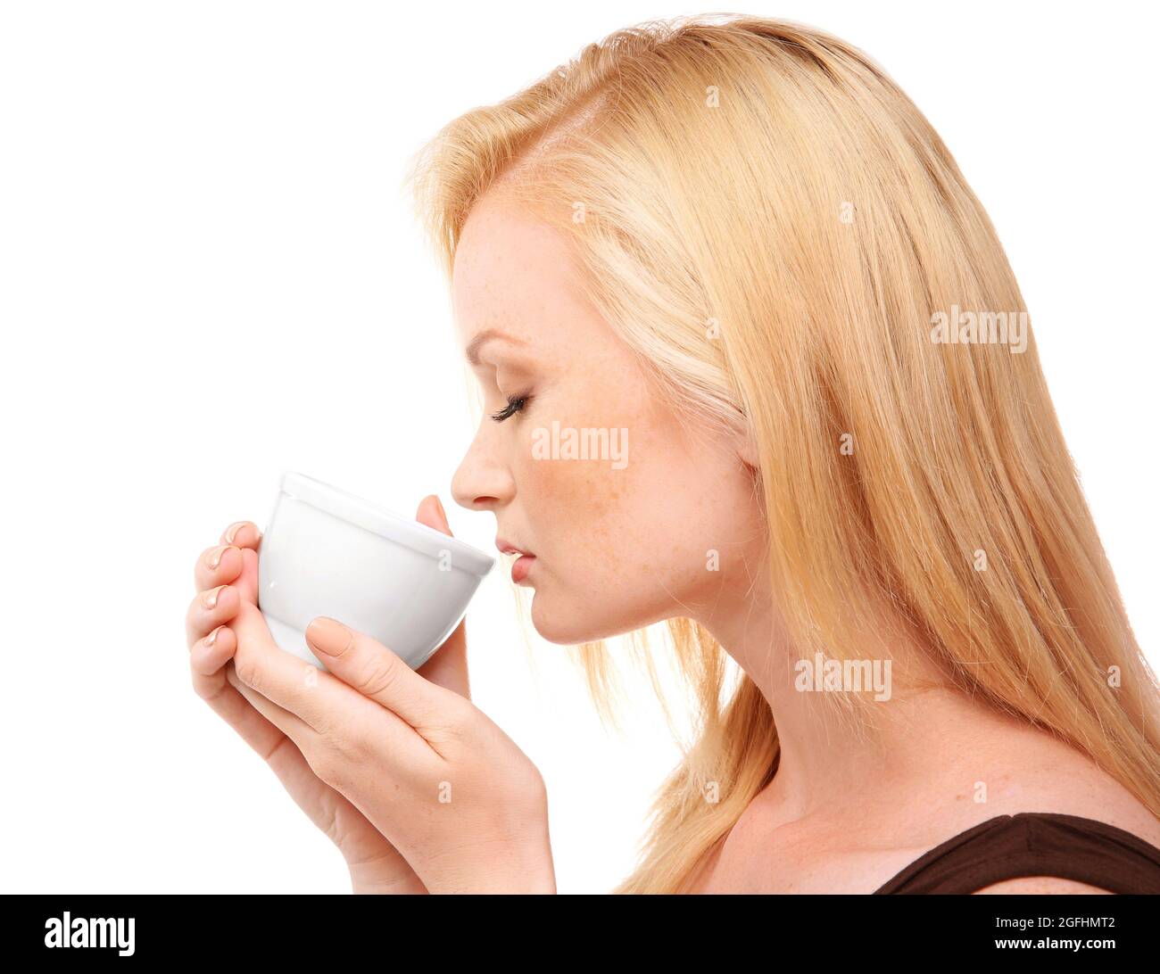 Beautiful girl with cup of coffee, isolated on white Stock Photo - Alamy