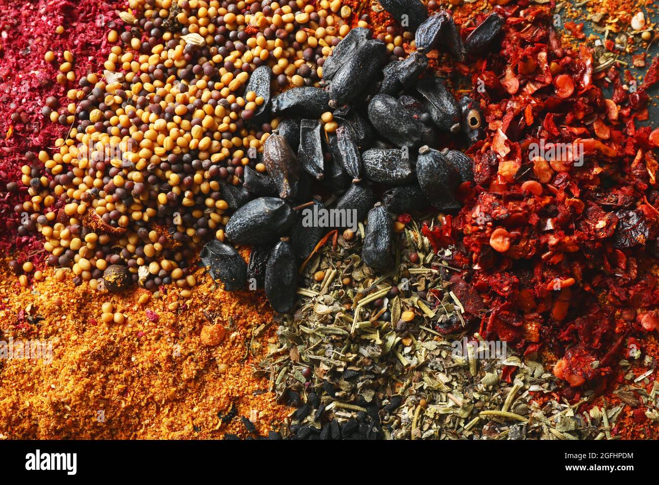 Mix of different flavored spices background Stock Photo Alamy