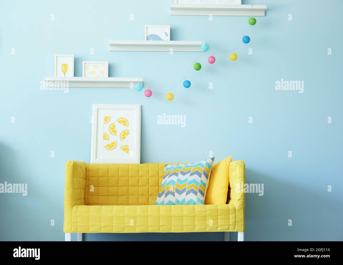 Modern living room interior design with yellow sofa Stock Photo - Alamy