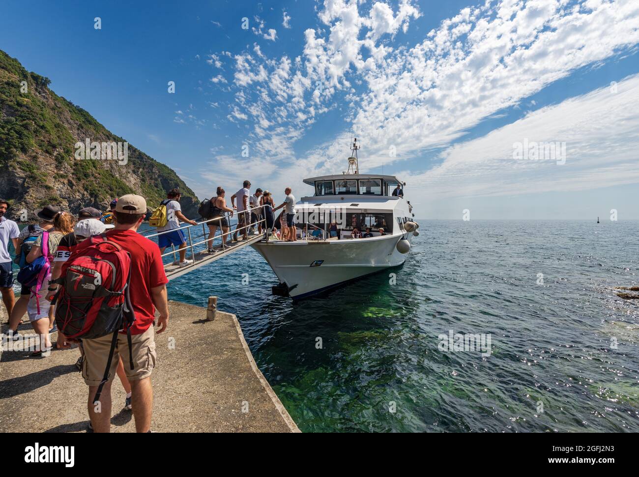 Ferry with tourists docked in front of the small village of Riomaggiore, Cinque  Terre National Park in Liguria, La Spezia, Italy, Europe Stock Photo - Alamy