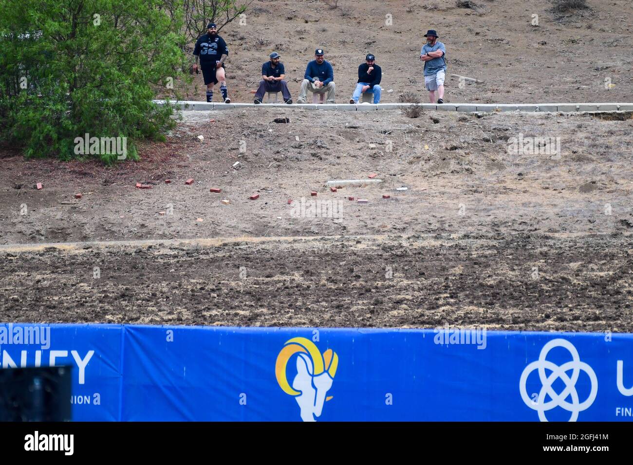 Fans observe a Las Angeles Rams and Las Vegas Raiders joint practice from a hillside on Wednesday, Aug 18, 2021, in Thousand Oaks, Calif. (Dylan Stewa Stock Photo