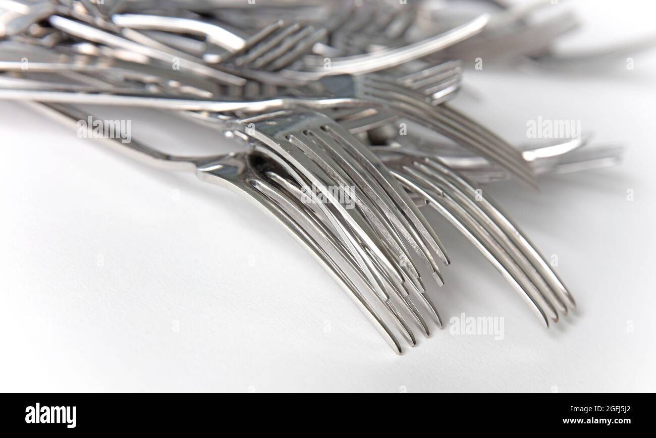 Pile of old metal forks, isolated on white Stock Photo Alamy