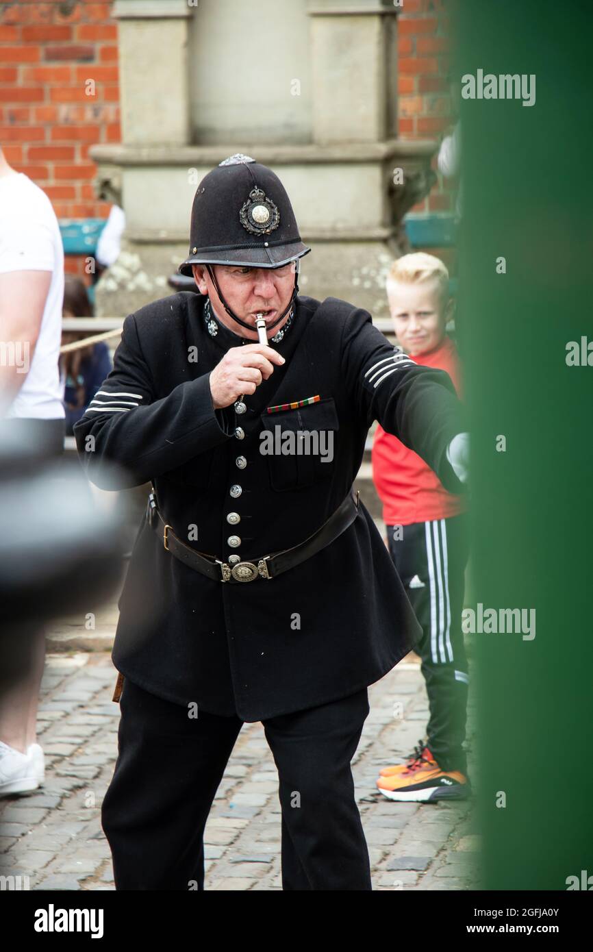Policeman blowing whistle hi-res stock photography and images - Alamy