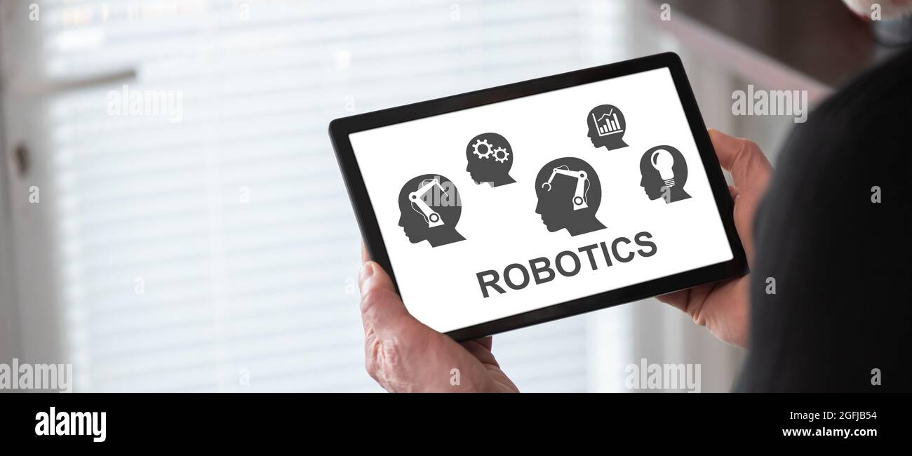 Robotics concept shown on a tablet held by a man Stock Photo