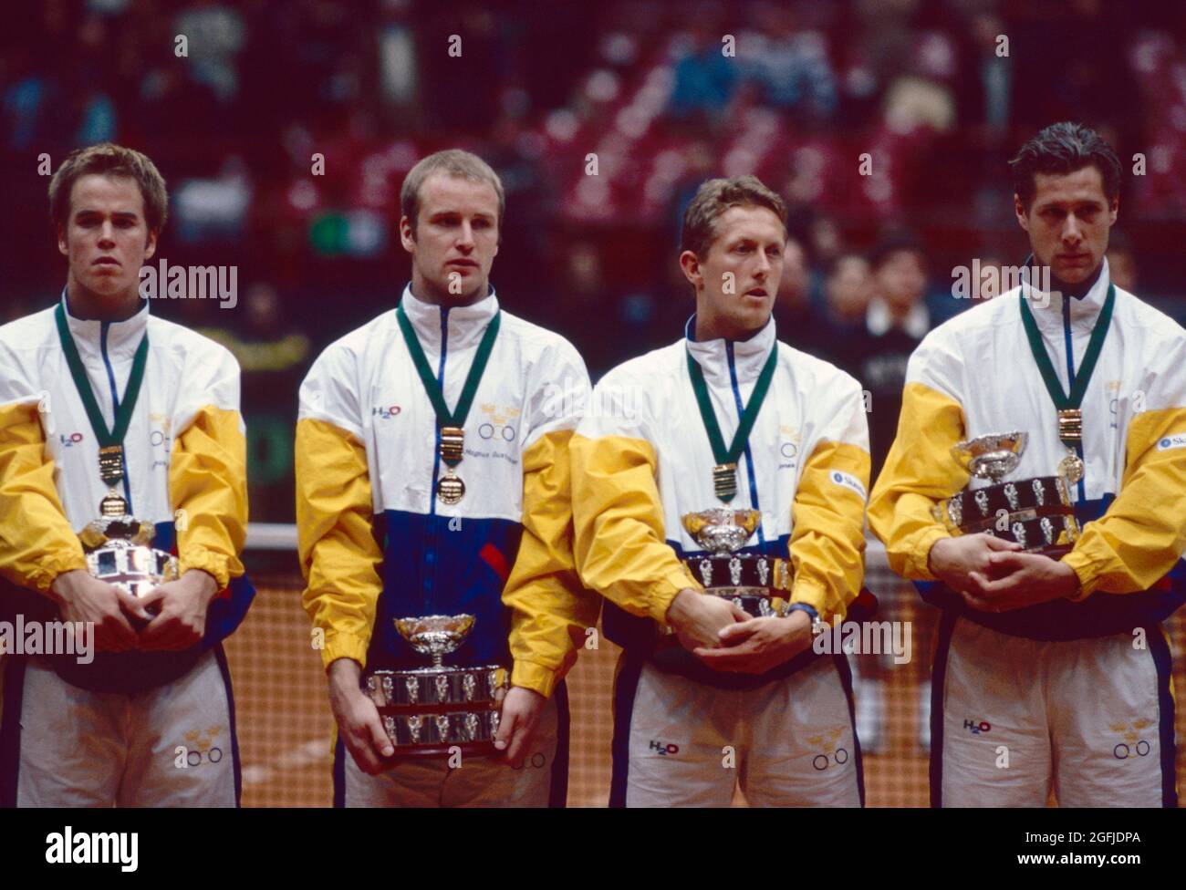 Swedish tennis team celebrating the victory with the Davis Cup trophy
