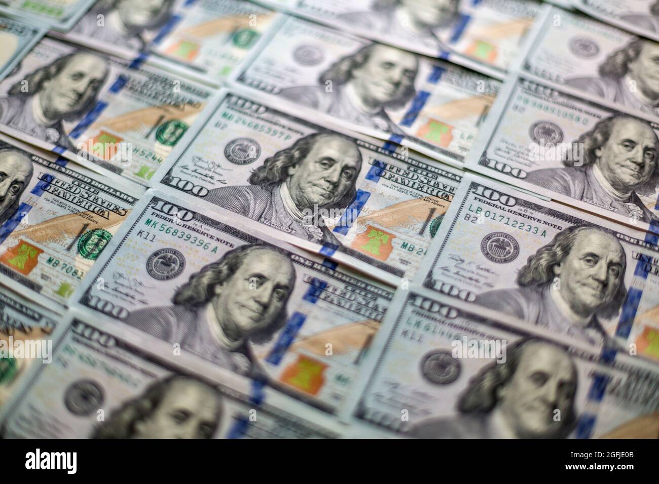 One hundred usd banknotes money as background, top view. Closeup view of dollars, US currency finance theme Stock Photo