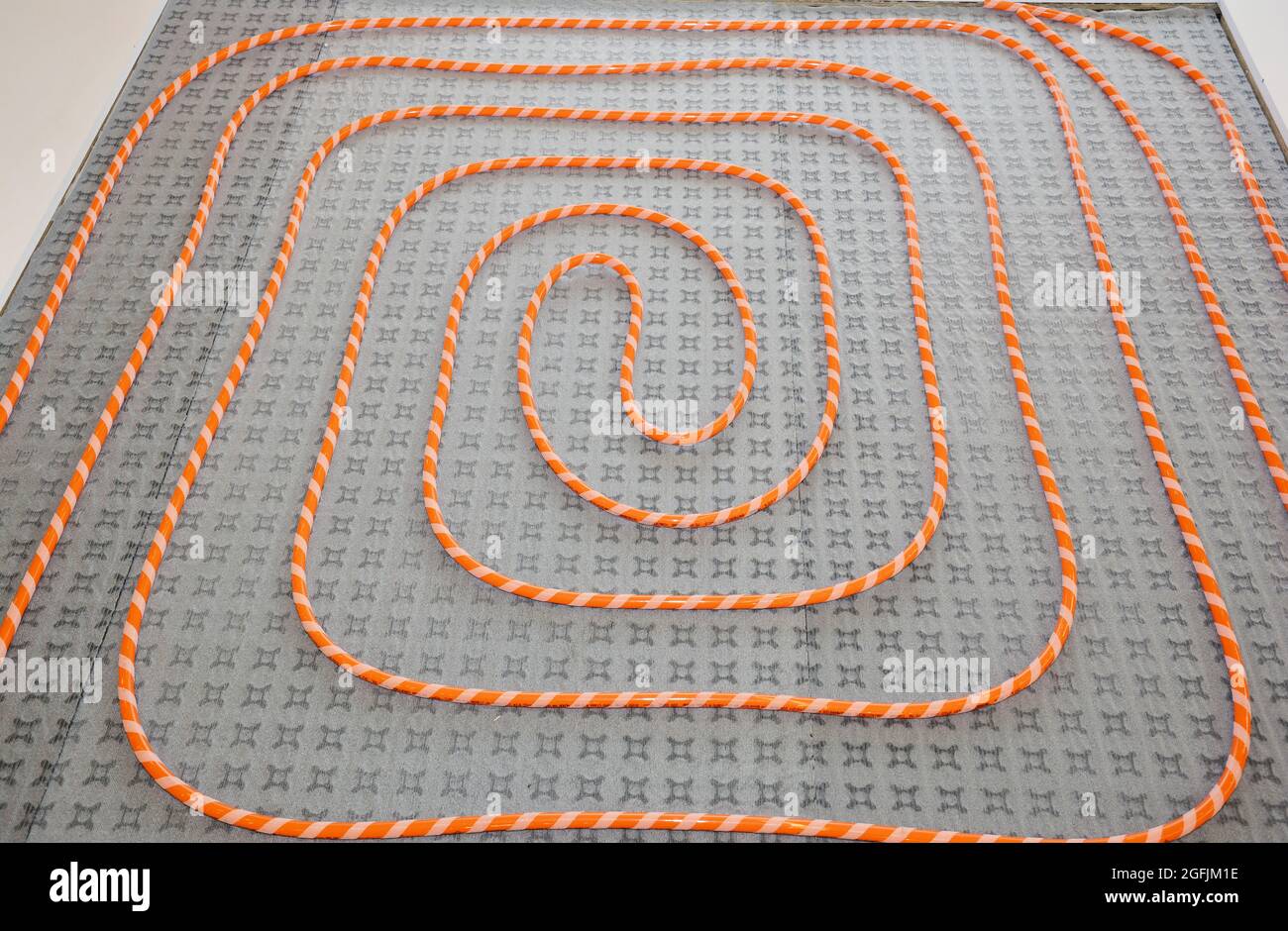 Installing radiant warm water underfloor heating system, laying the