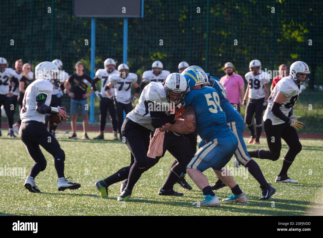 Kiev Ukraine, 15 August 2021, Players in sports uniforms on the field of playing American football. Ukrainian Championship Lvov Lions vs Kiev Capitals Stock Photo