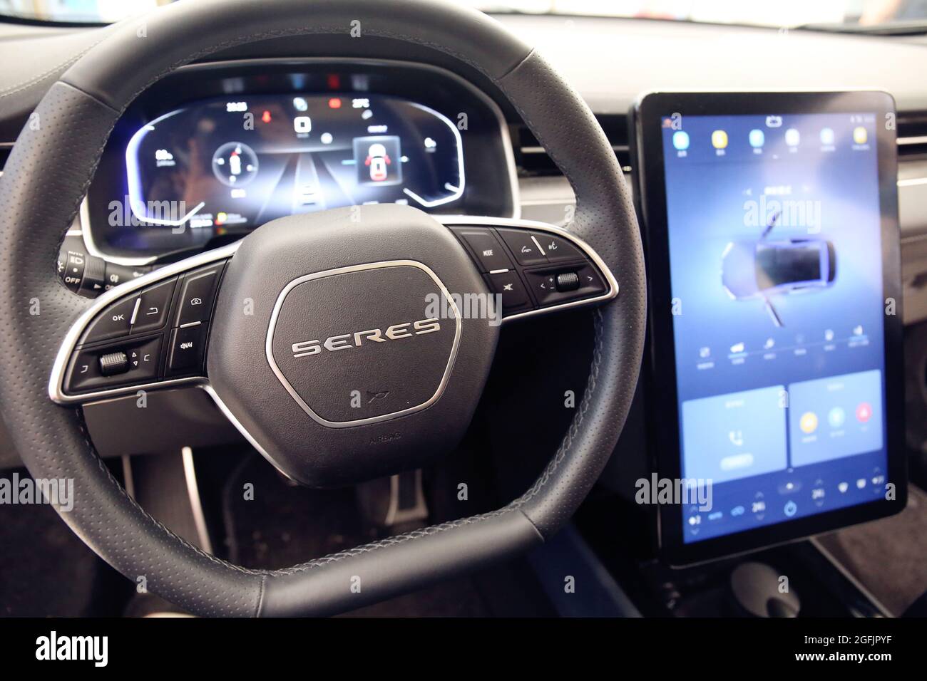 SHANGHAI, CHINA - JUNE 14, 2021 - Customers experience a SERES SF5 new  energy electric smart car at a Huawei flagship store in Shanghai, China,  June 14, 2021. Aug 25, 2021 -