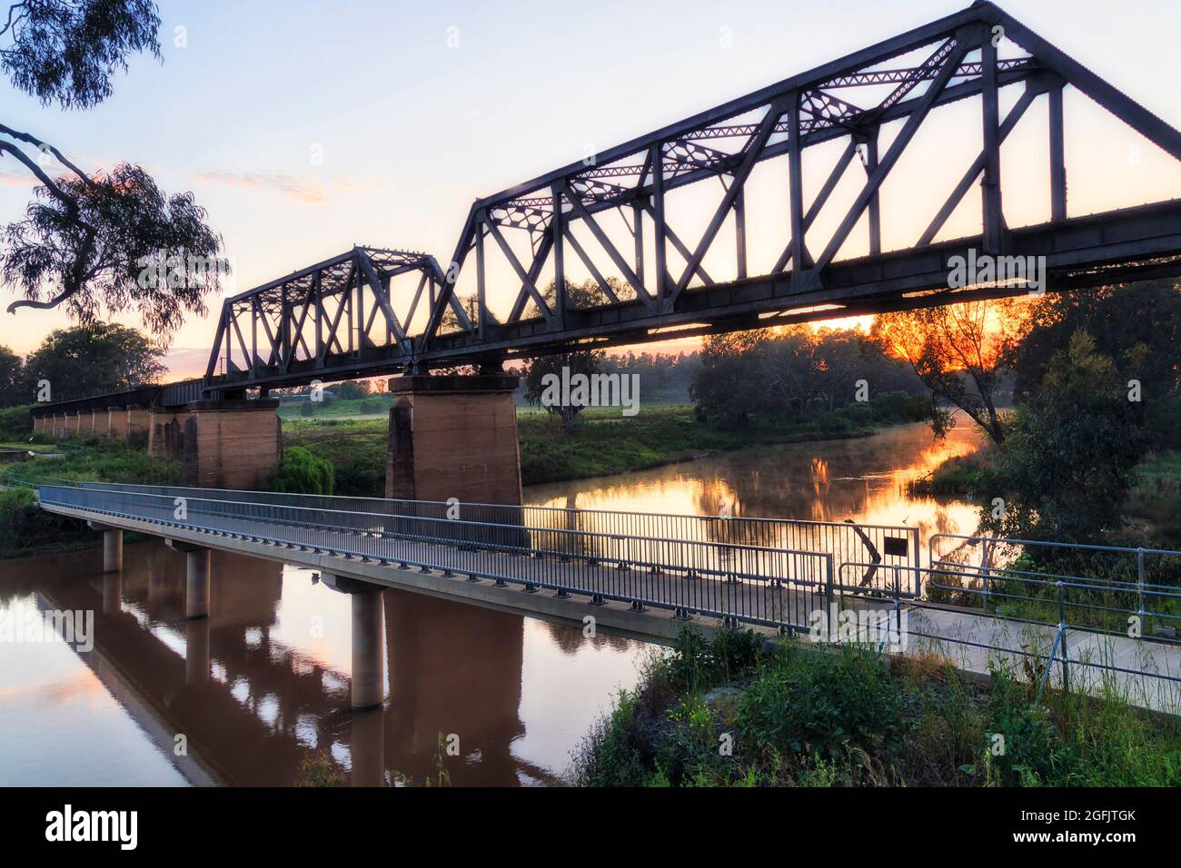 Steel arch of historic railway bridge across Macquarie river in Dubbo