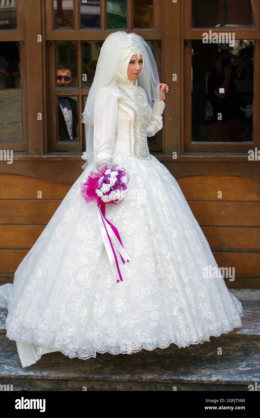 Istanbul, Turkey - June 8, 2014: Muslim bride at the Ortakoy Mosque in Istanbul on a summer day. Stock Photo
