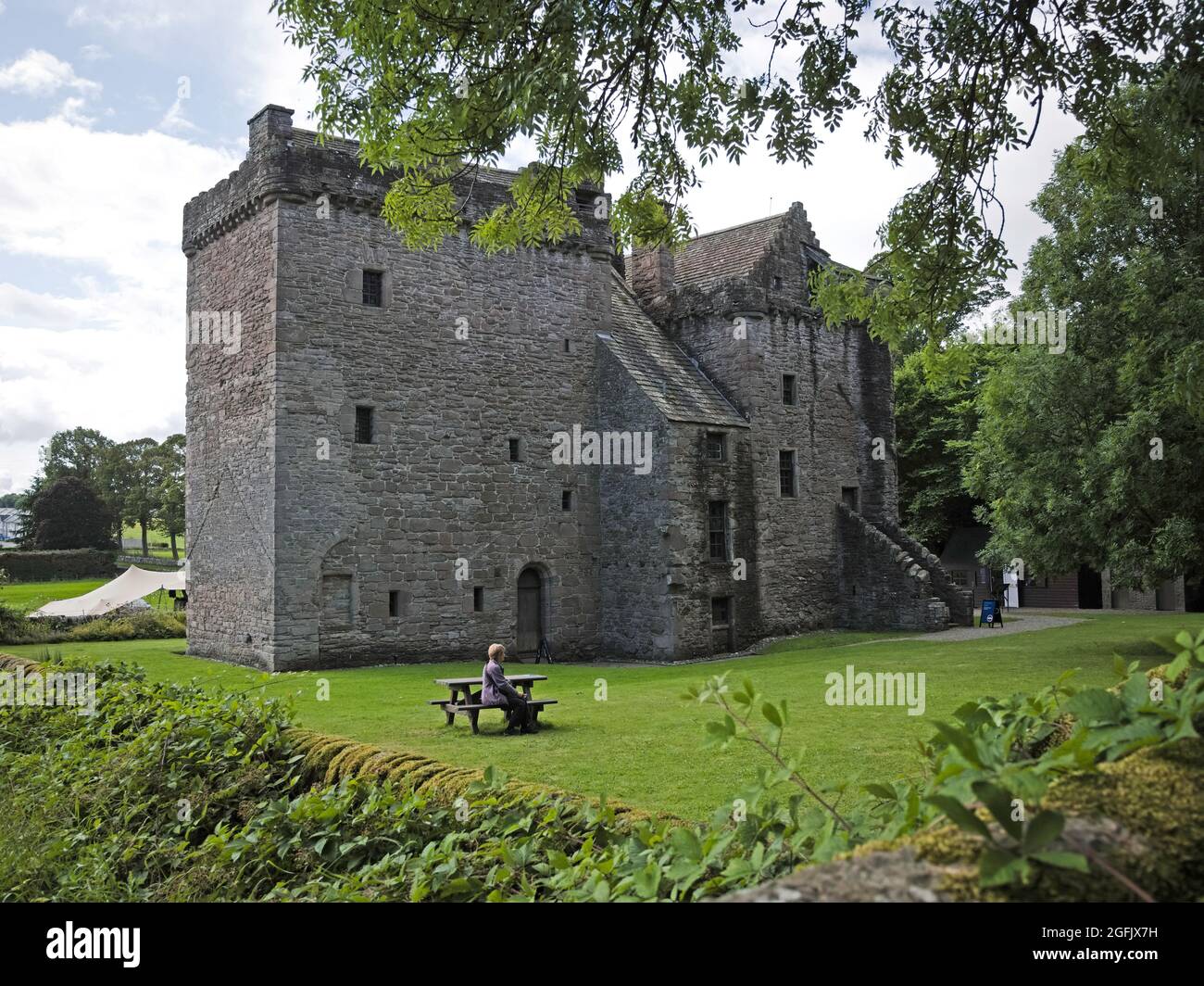 Huntingtower near Perth with lady sitting at picnic table Stock Photo