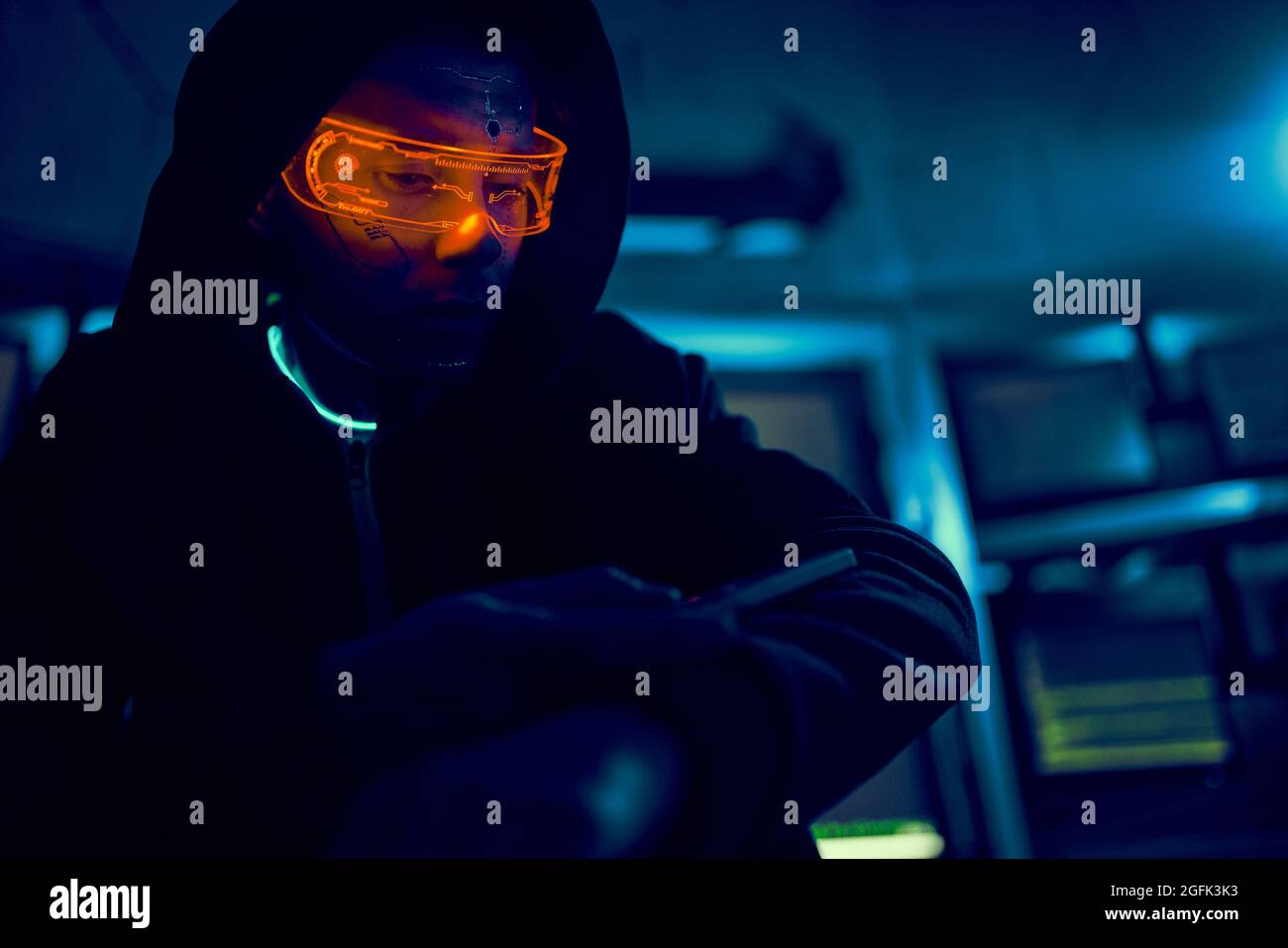 Cyber hacker breaks into databases to obtain information using a computer. Cybercrime and data security concept. Stock Photo