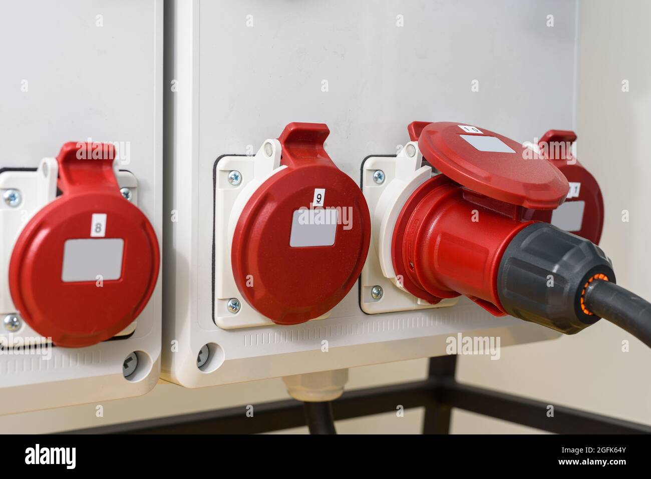 Industrial sockets and plug on distribution board. Construction site
