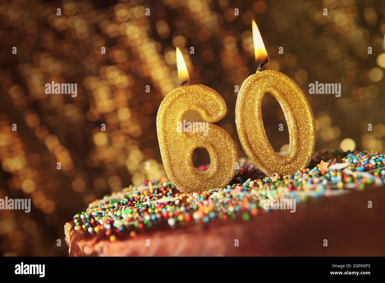 Birthday cake with burning candles on blurred background Stock Photo ...