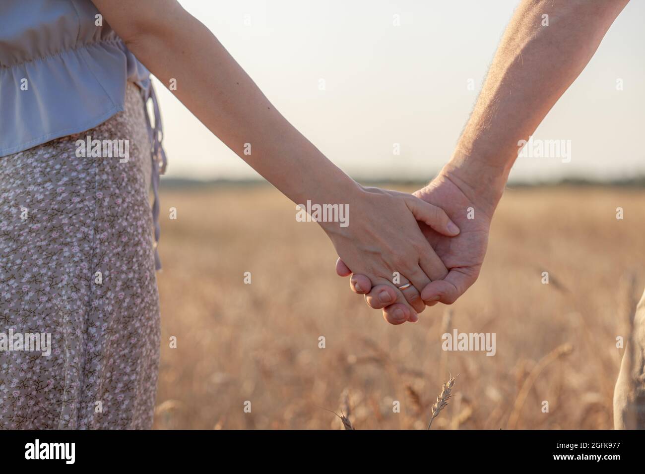 Couple hand holding field hi-res stock photography and images - Alamy