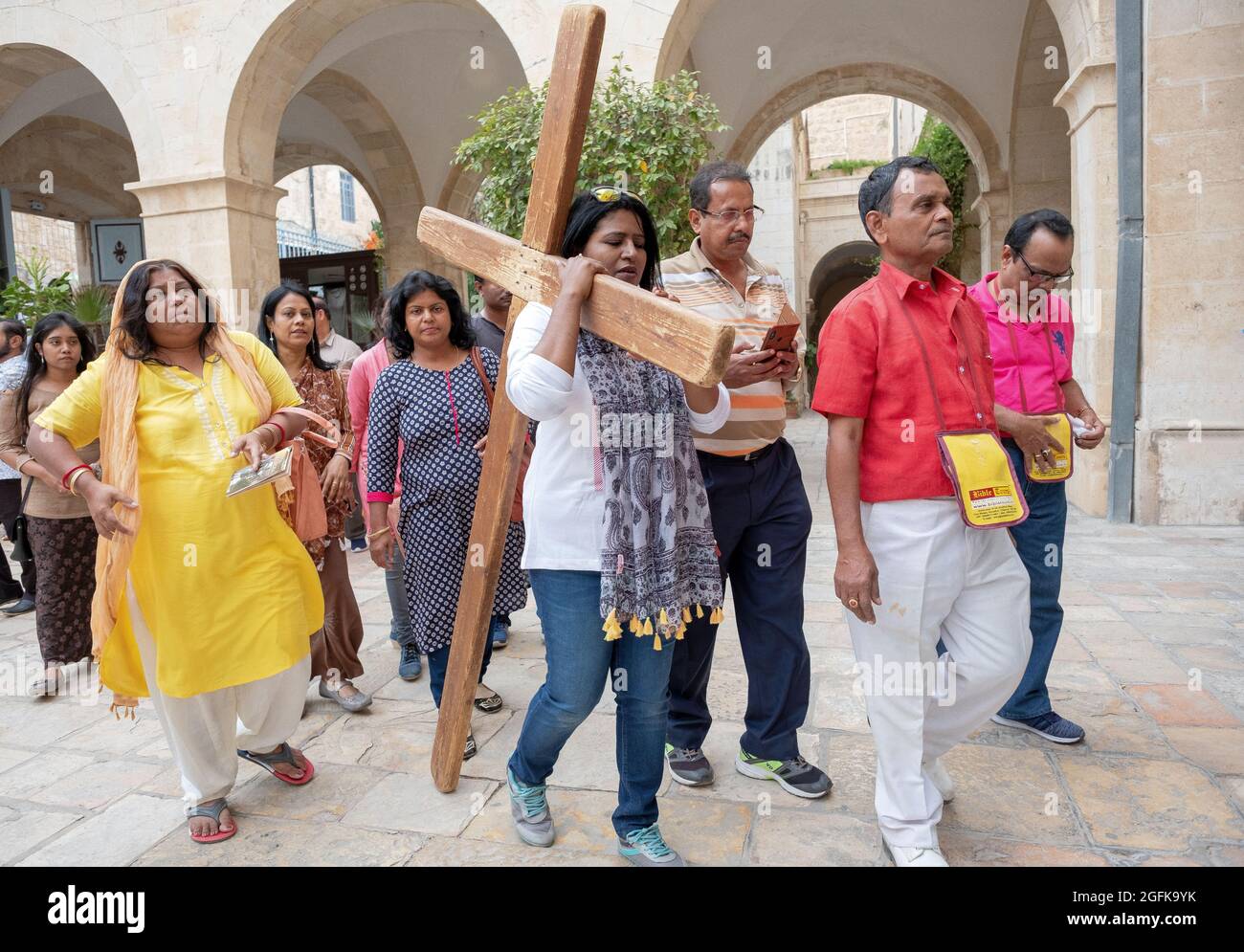 Tourists from India reenact the stations of the Cross ritual in the Old ...