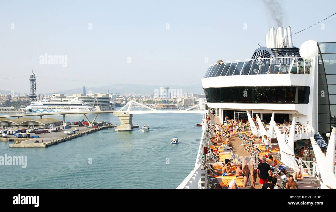 Deck of a cruise ship with people saying goodbye in the port of