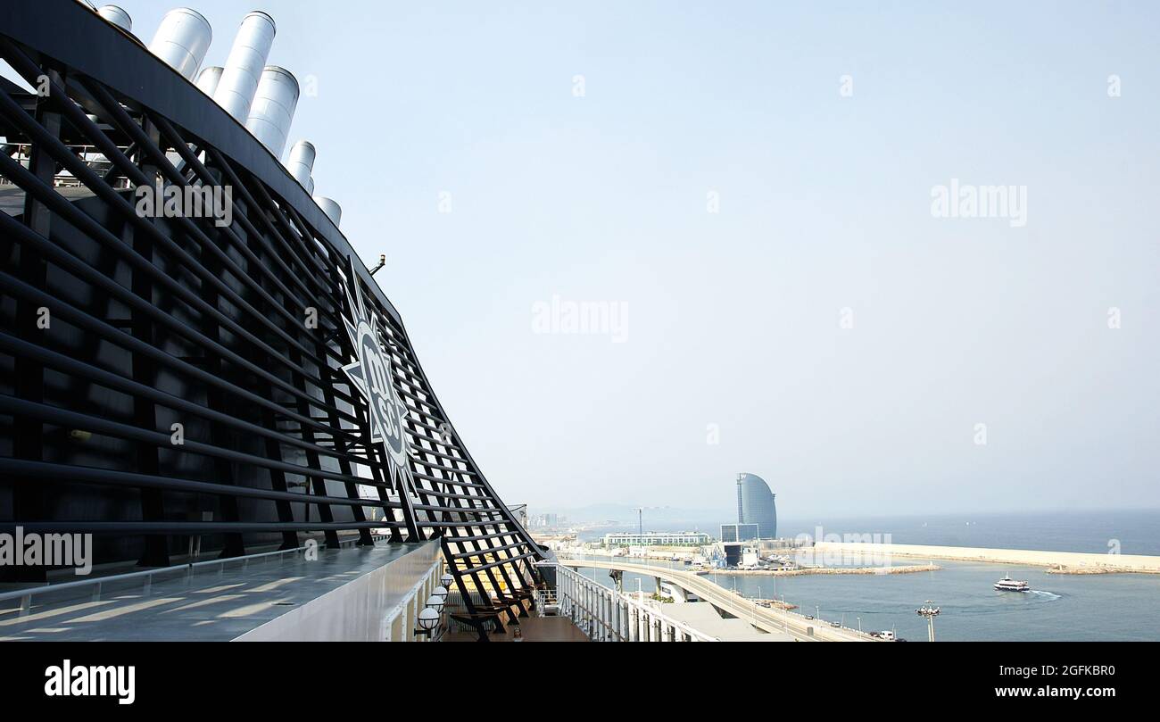Deck of a cruise ship with people saying goodbye in the port of