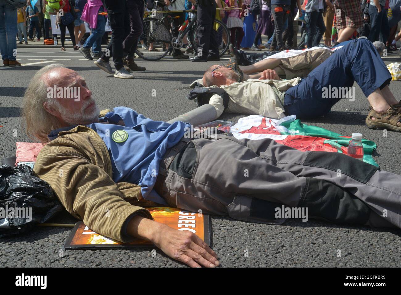 Activists chained together, during the demonstration. Climate change activists from Extinction Rebellion demonstrate at Parliament Street, Westminster Stock Photo