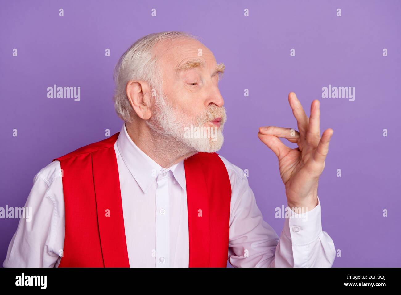 Photo of cheerful positive happy joyful man make fingers chef kiss delicious meal isolated on violet color background Stock Photo