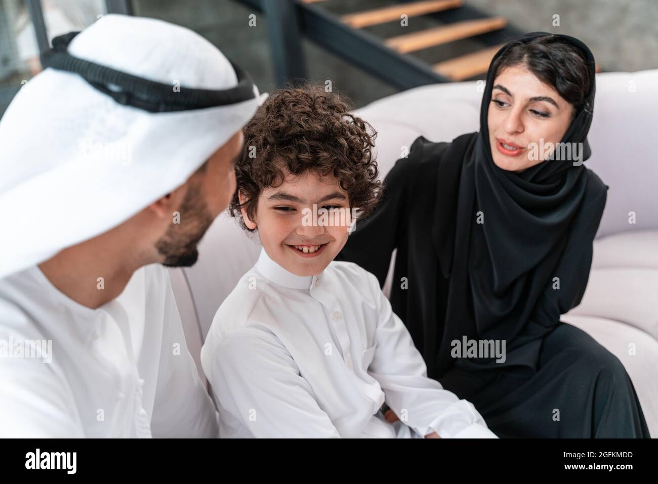 happy family spending time together. Arabian parents and their son ...