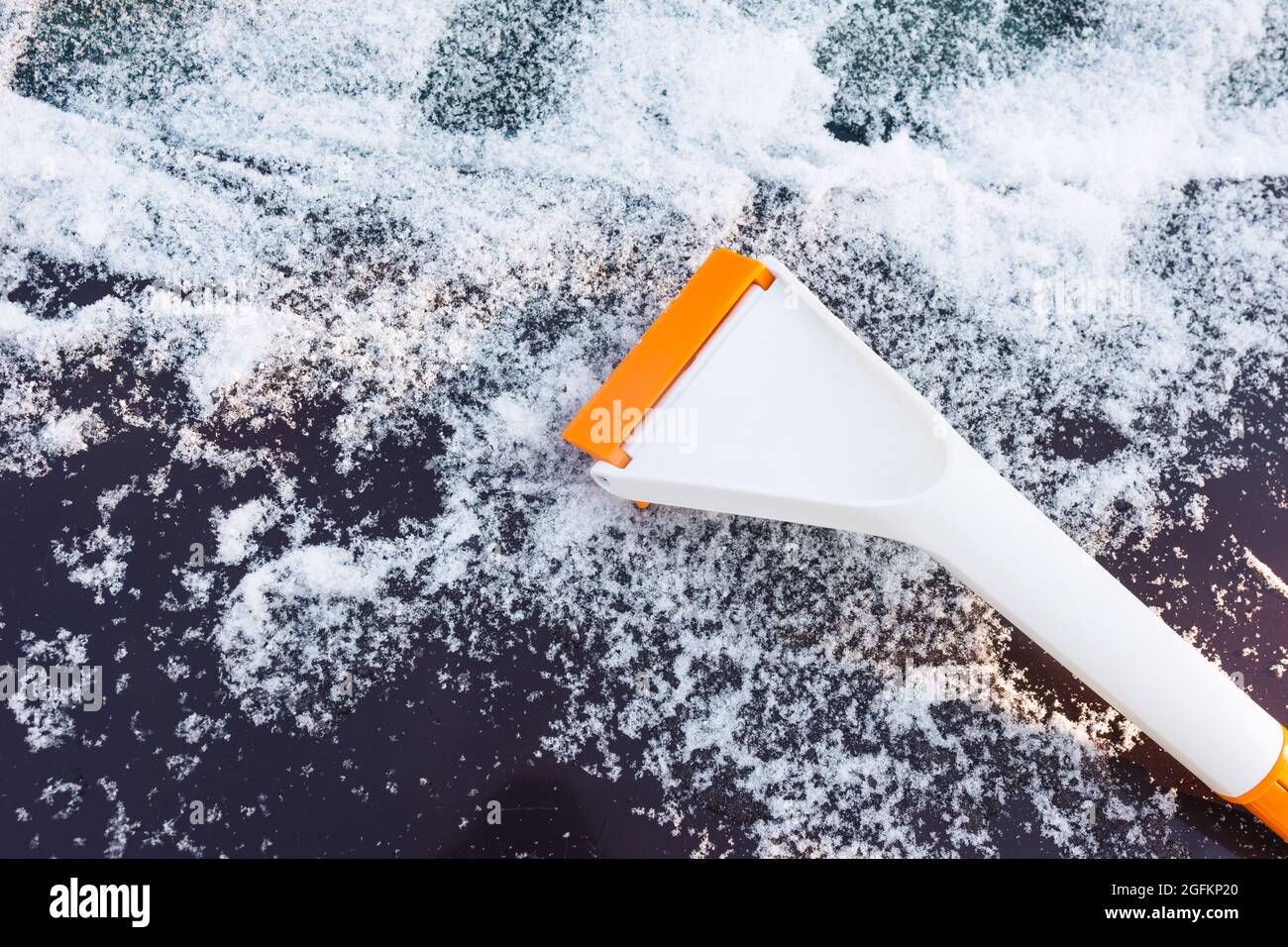 Scraper for cleaning ice from car windows Stock Photo Alamy